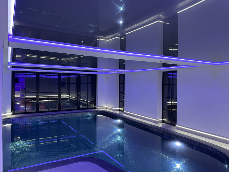 Modern stretch ceiling with LED lighting in home