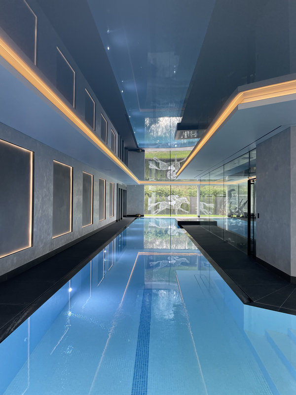 Stretch ceiling with LED lighting in indoor swimming pool