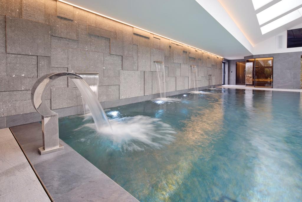 Stretch ceiling with LED lighting in indoor swimming pool